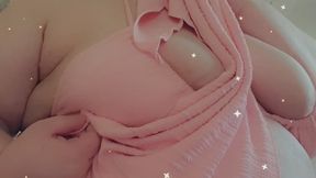 A sexy bikini strip tease in a pale pink bikini