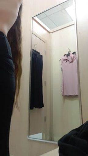 Trying on a cute dress.