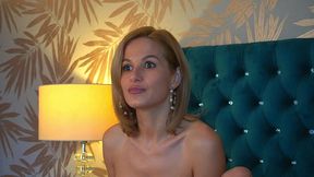 she pauses every now and then to flash a flirtatious smile at the camera