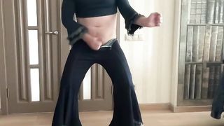 Crossdresser homo transgirl in broad gam bootcut flare denim and whip top and high high-heeled shoes dancing for his sir and domme