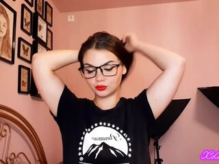 Sensual brunette smoking and wearing geek glasses