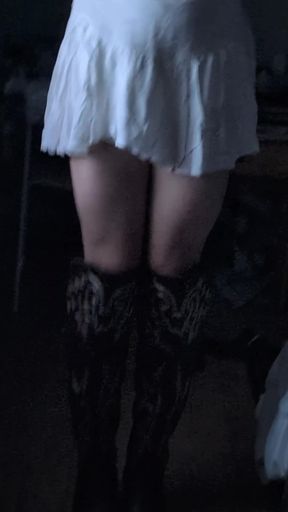 Trans girl in a skirt shows off her slim body while playing