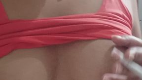 smoking with her beautiful breasts exposed