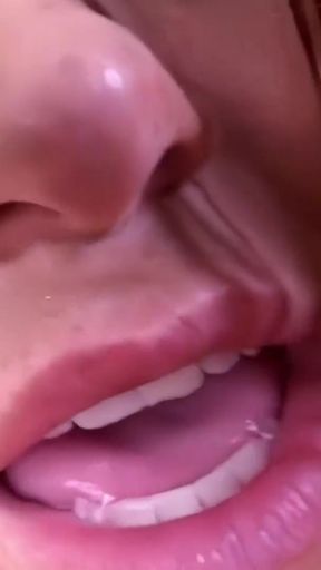 A robust brunette and a fair-haired blonde alternate in riding and suckling a large, dark phallus.   Clip 1