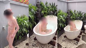 bathing in an outdoor bath in a foreign country with old men and chickens nearby