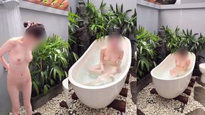 bathing in an outdoor bath in a foreign country with old men and chickens nearby