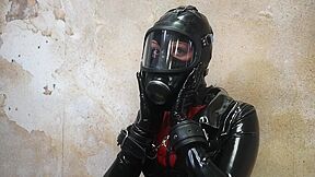 Restrained In Latex And Gasmask