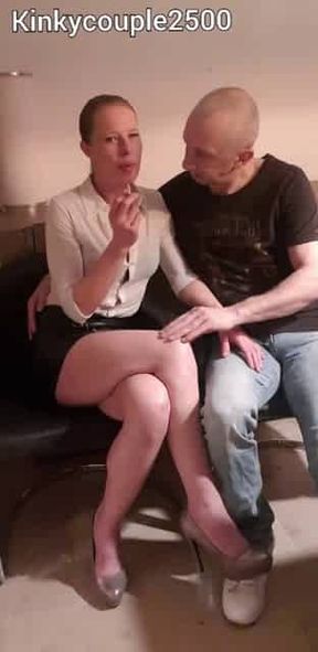 Smoking kisses in leather skirt
