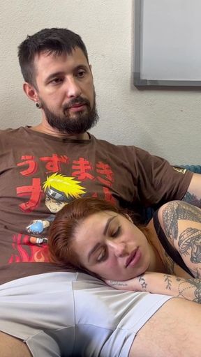 Tattooed Redhead Lies on Her Lap to Watch a Movie and Ends Up Sucking Your Hard Cock