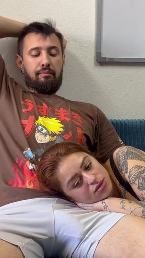 Tattooed Redhead Lies on Her Lap to Watch a Movie and Ends Up Sucking Your Hard Cock
