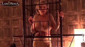 ”Lady Sonia caged & strips nude in the sex dungeon”