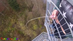 I pee outside from a very public observation tower and then masturbate my penis, and my balls are fat. But then people...