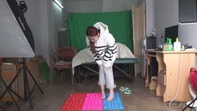 Foot sensitive Tao Tao steps onto a Shiatsu board