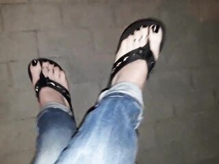 a crossdresser on a night walk walks around and tempts with his gorgeous feet