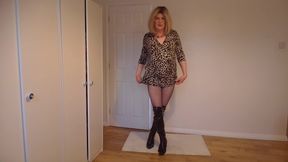 Sissy blonde in leopard print dress, fishnets and latex boots