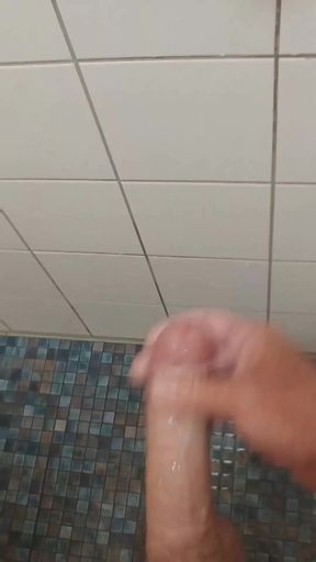 Wanked in the swimming pool under the shower   Clip 1