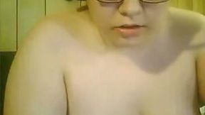 Ugly foureyed bitch with big boobs masturbating on webcam