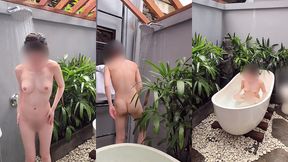 bathing in an outdoor bath in a foreign country with old men and chickens nearby
