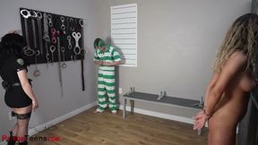 Naked blonde in cuffs getting dominated by a guard in fishnets and boots
