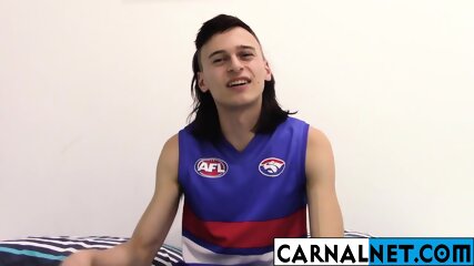 Cute Australian guy licks his own massive ten-inch cock!