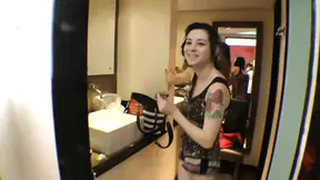 Tattooed cutie w/ curly hair in a hot position
