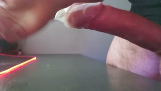 Edging, leaking and filling up a shinny condom with some post orgasm jerking