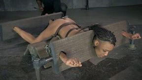 Restrained ebony hoe gets her pussy punished