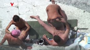 two hot wives giving head on public beach in daylight