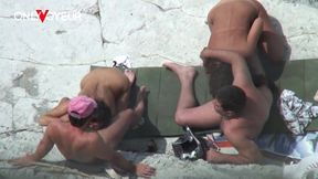 two hot wives giving head on public beach in daylight