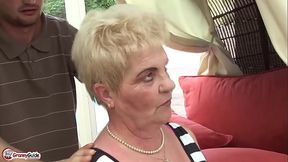 Granny gets a wild titfuck from her younger boyfriend