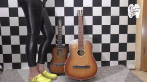 Two Guitars under wooden Clogs