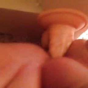 Laying on back fucking dildo stuck to the wall while jerking off on myself