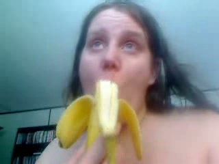 White trash whore on webcam chews banana and shows it