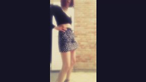 Janelle shakes her massive penis under skirt