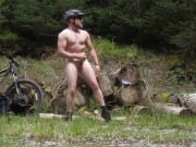 Muscle stud gets naked on a bike ride in the woods, flexes muscles and cums (old vid)