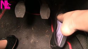 Revving my car in black leather flats and popping out my long toes out