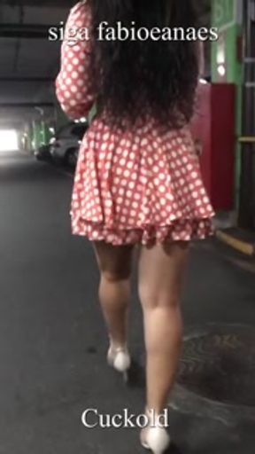 Hot naughty hotwife shows off in the mall parking lot for cuckold, walking in catwalk style mini ski