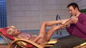 Beautiful blonde by the pool fucks a stranger's willing cock with her feet