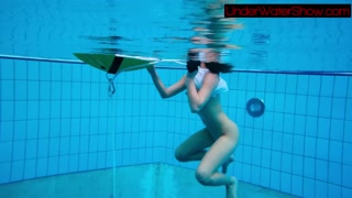 Sexy cute beauty Alla swims in the swimming pool