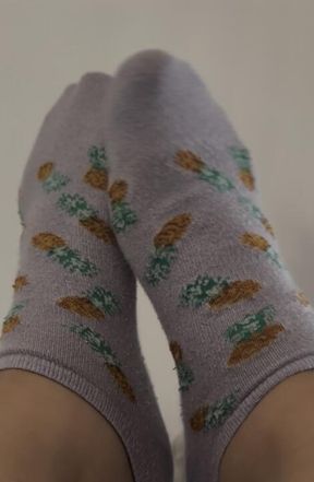 Feet caressing each other