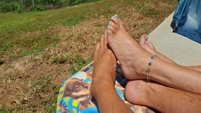 Rubbing our tanned oiled feet together in the sun