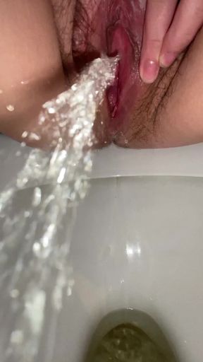Pee diary: close up peeing in toilet