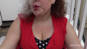 Smoking in a red dress