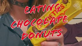 Eating chocolate little donuts