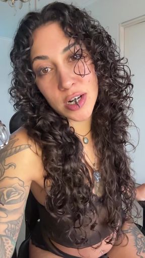 Curvy girl shows off her figure while sitting alone