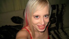 Cute-looking blonde Teena stimulates her wet hole on the cam