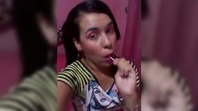 Kinky teen gal sucking lollipop while playing with her punani