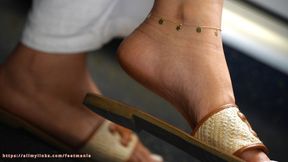 Dirty feet slippers dangling, ignoring foot fetish, amazing feet and baresoles close-up.