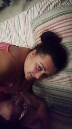 Busty wife gives her husband a handjob