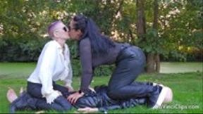 We kiss on human latex bench at the sunset